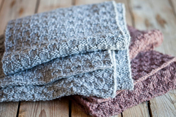 istock Knitted woolen grey and brown scarves. 1143562958