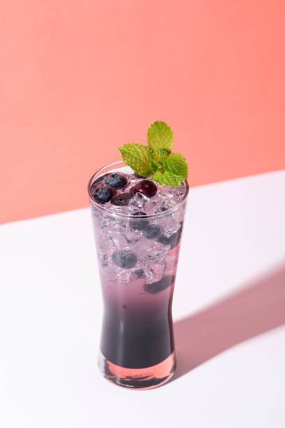 istock Cold and refreshing  blueberry punch cocktail with mint on color background. summer drink 1143563866