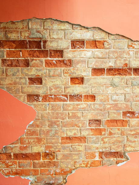 istock Textured wall of red brick and red plaster. 1143564796