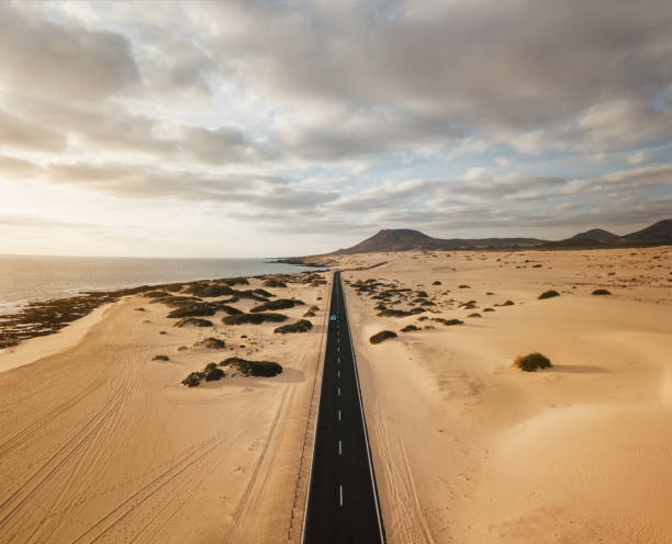 istock Aerial view of an empty road through the sand dunes 1143566599