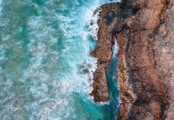Man relaxing in the natural swimming pool
