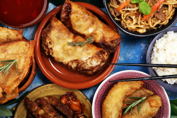istock Assorted Chinese food set. Chinese noodles, fried rice, peking duck, dim sum, spring rolls. Famous Chinese cuisine dishes on table. Chinese restaurant 1143569865