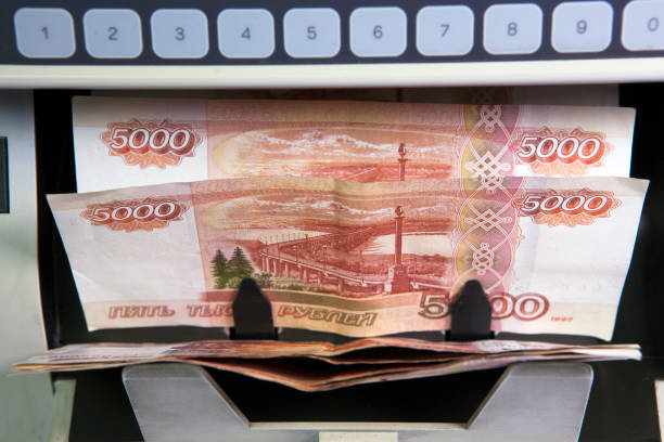 istock electronic money counter machine is counting the Russian five-thousandth ruble banknotes 1143571051