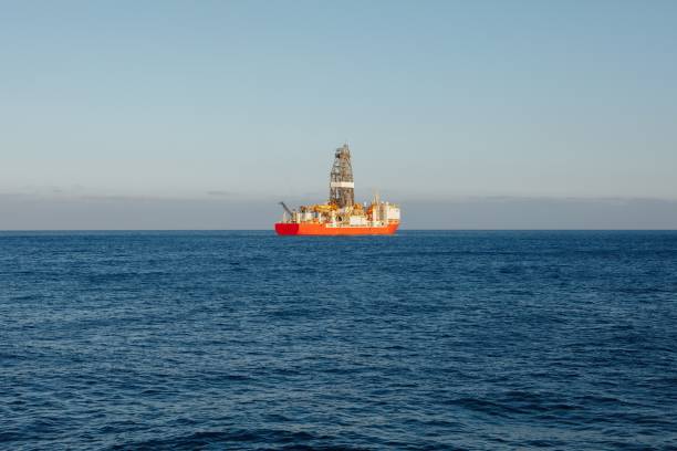 istock offshore oil and gas drillship, blue ocean background 1143571468