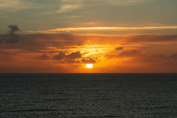 istock sunset at ocean seascape with clouds 1143571675