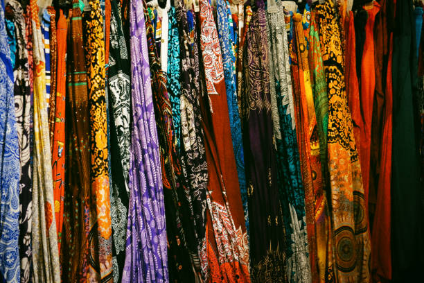 istock a large number of colorful shawls, patterned textiles, background 1143575891