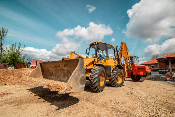 istock Yellow bulldozer excavator on the construction site warehouse working machine 1143576076