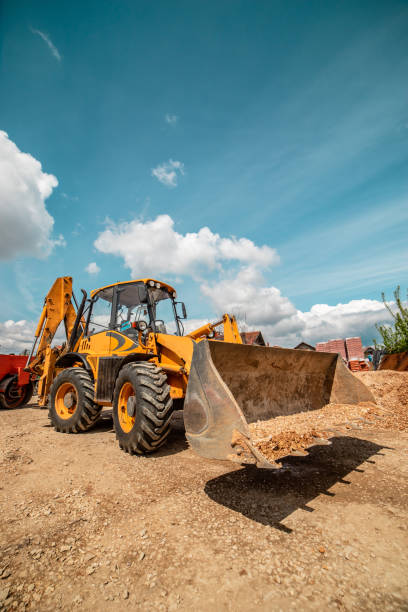 istock Yellow bulldozer excavator on the construction site warehouse working machine 1143576079