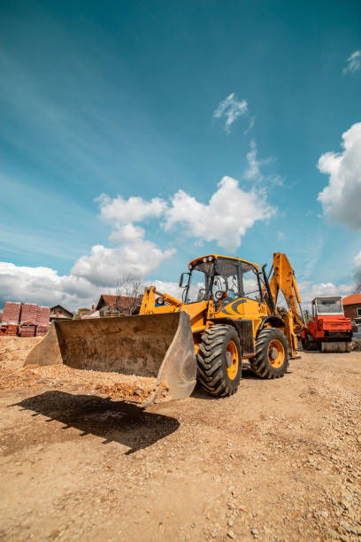 istock Yellow bulldozer excavator on the construction site warehouse working machine 1143576209