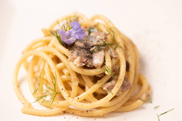 istock Italian pasta with sardienes, close up 1143576362