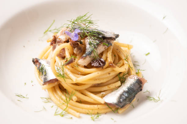istock Italian pasta with sardienes, close up 1143576421