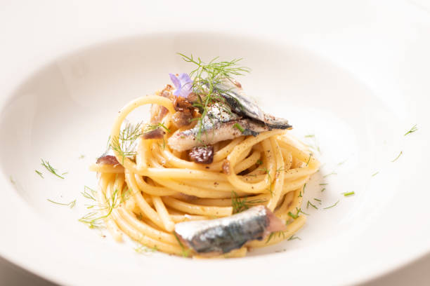 istock Italian pasta with sardienes, close up 1143576436