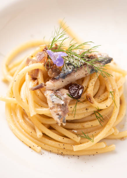 istock Italian pasta with sardienes, close up 1143577086