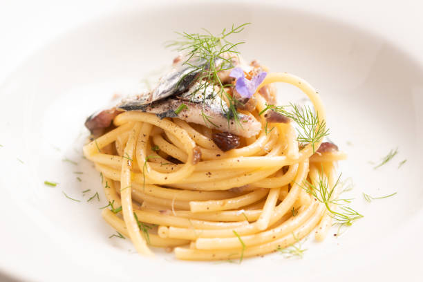 istock Italian pasta with sardienes, close up 1143577124