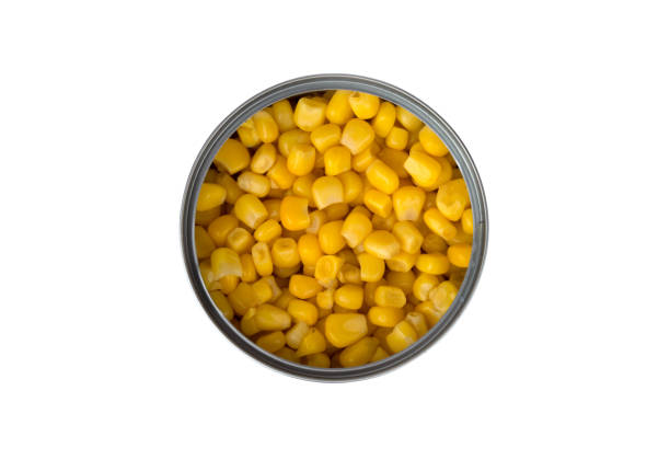 istock Canned corn on a white background. Corn closeup in an iron jar on a white background. 1143586676