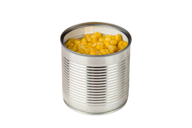istock Canned corn on a white background. Corn closeup in an iron jar on a white background. 1143586683