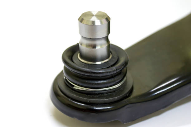 Ball joint on front lower control arm for Japanese car on white background, isolated.
