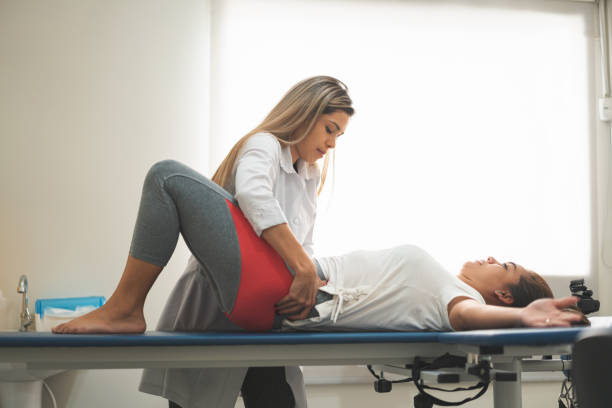istock GPR - Global Postural Re-education, preparing the patient to correct the posture 1143592526