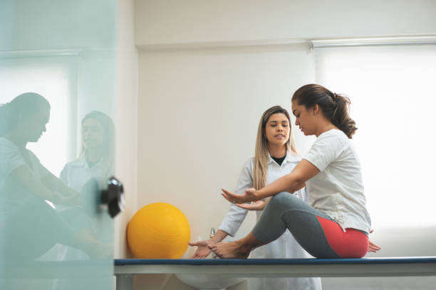 istock GPR - Global Postural Re-education, preparing the patient to correct the posture 1143593186