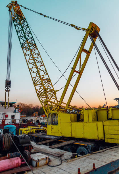istock Old working ship and yellow crane in Sava river in Belgrade 1143596878