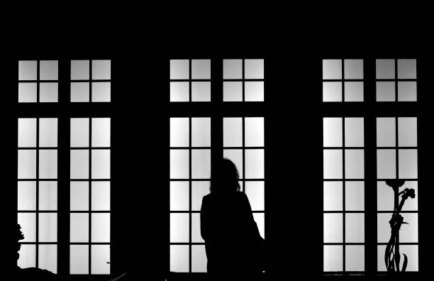 istock the lady and the window 1143603656