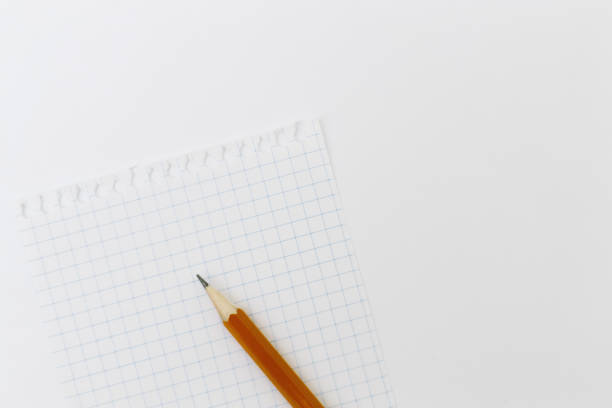 istock Blank white paper with pencil on a white desk. High quality graphic collage. 1143611221
