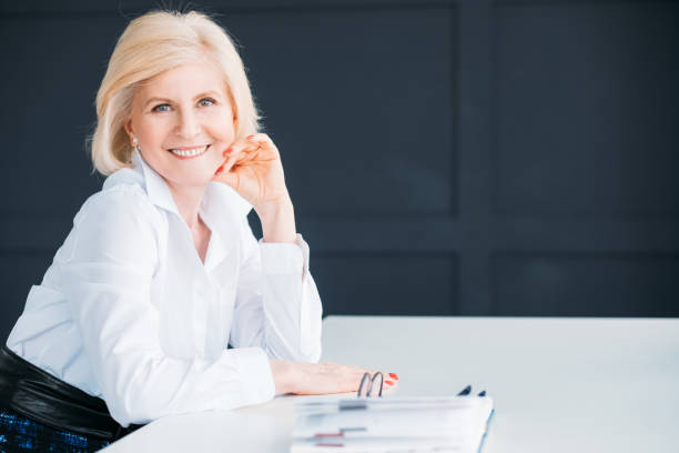 istock smiling business woman break time hand cheek 1143611722