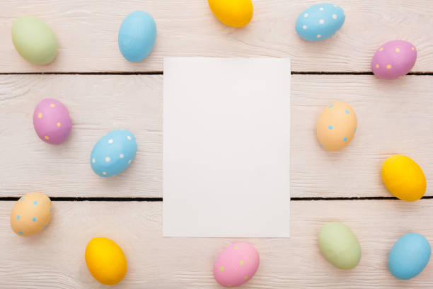 istock Easter traditional objects isolated on wooden background virtical paper with eggs 1143612632
