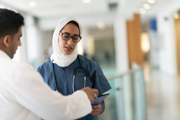 istock Two doctors discuss treatment plan in hospital corridor 1143612689