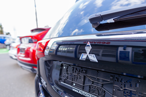 Nuremberg / Germany - April 7, 2019: Mitsubishi logo on a Mitsubishi car at a car dealer. Mitsubishi Motors Corporation is a Japanese multinational automotive manufacturer headquartered in Japan.