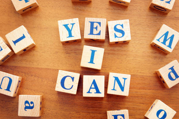 istock Yes I can. Conceptual image with the text made from wooden cubes on a desk 1143615751