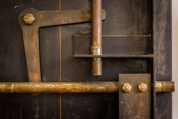 istock Old bank vault door mechanism 1143616442