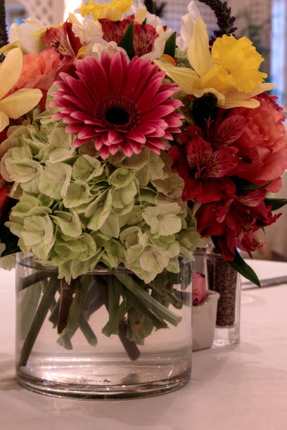 istock Spring bouquet of pink Gerbera daisies, yellow daffodils 1143617562