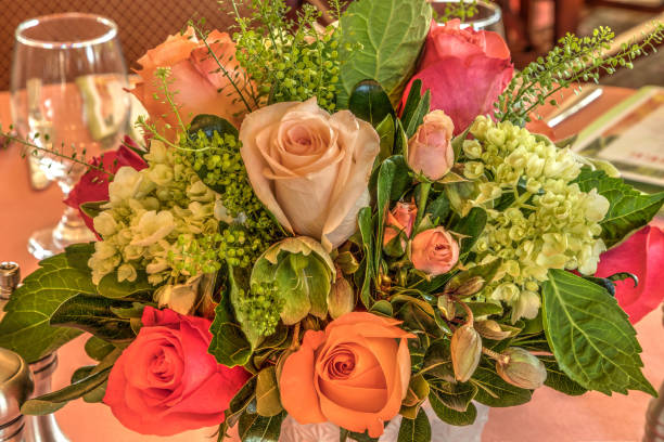 istock Pale peach roses, green hydrangea, and pink roses 1143618213