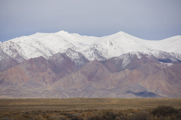 istock Stock image desert landscape with mountain snow 1143618985