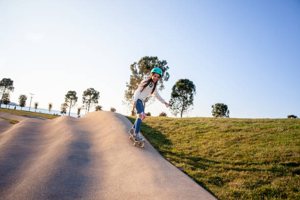 istock Little skateboarder cruising in the Public Park 1143619059