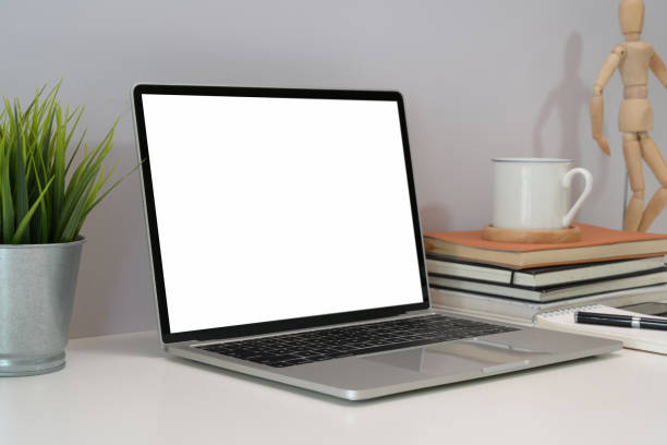 istock Blank screen laptop at workplace in office 1143627741
