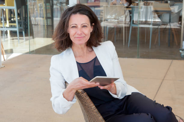 istock Positive relaxed business woman enjoying work break 1143629500