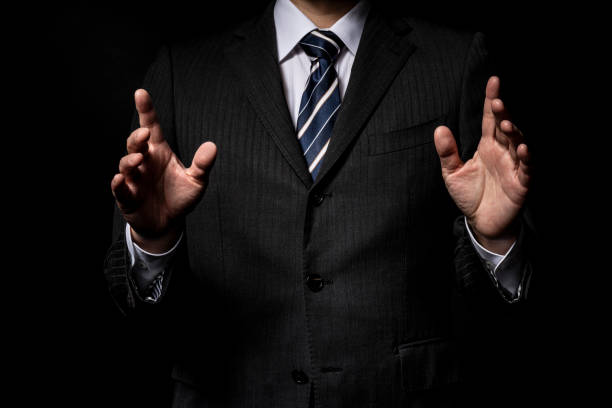 Men in a suit speaking with a gesture
