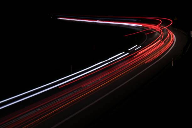 istock lights of cars with night 1143636421