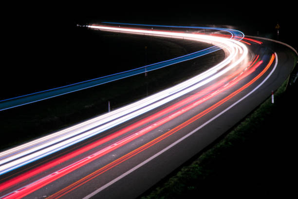 istock lights of cars with night 1143636423