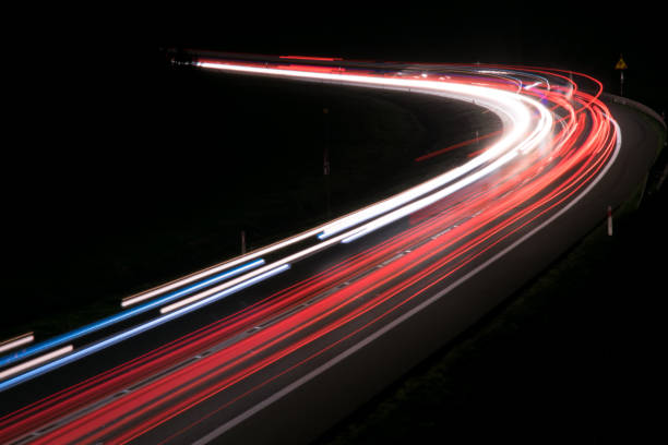 istock lights of cars with night 1143636456