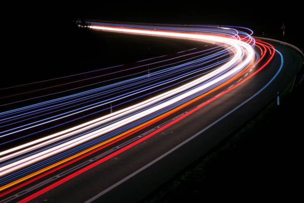 istock lights of cars with night 1143636474