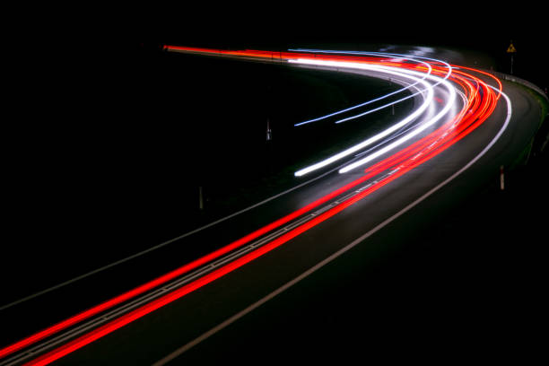 istock lights of cars with night 1143636613