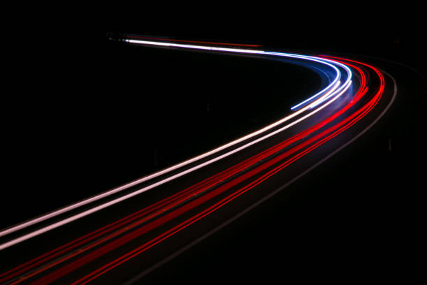 istock lights of cars with night 1143636624