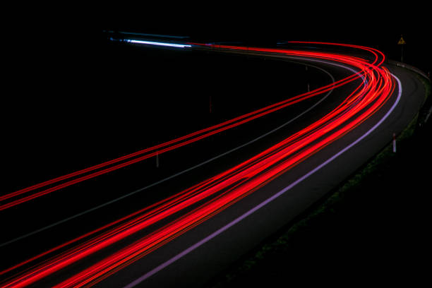 istock lights of cars with night 1143636648