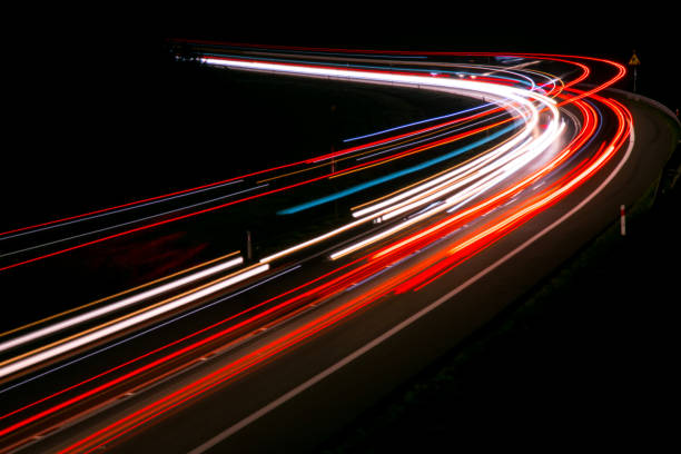 istock lights of cars with night 1143636671