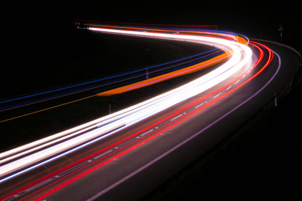 istock lights of cars with night 1143636704