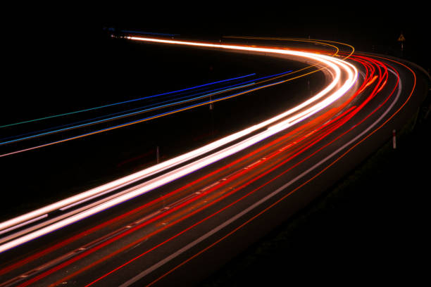istock lights of cars with night 1143636716
