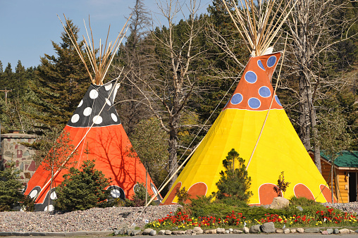 Orange and yellow tipi lodging at a holiday resort in Glacier National Park,USA.